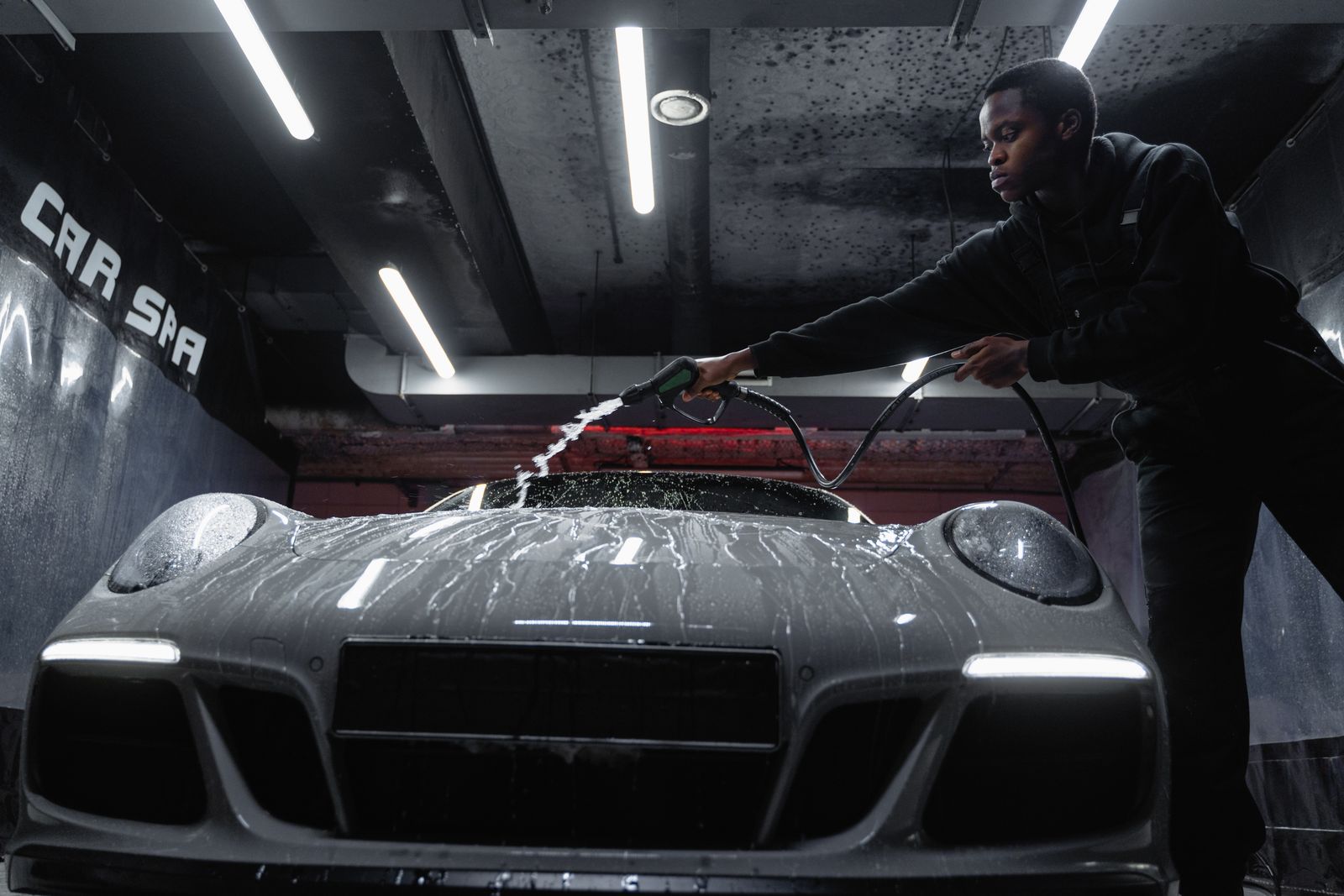 A car being washed by hand during a detail